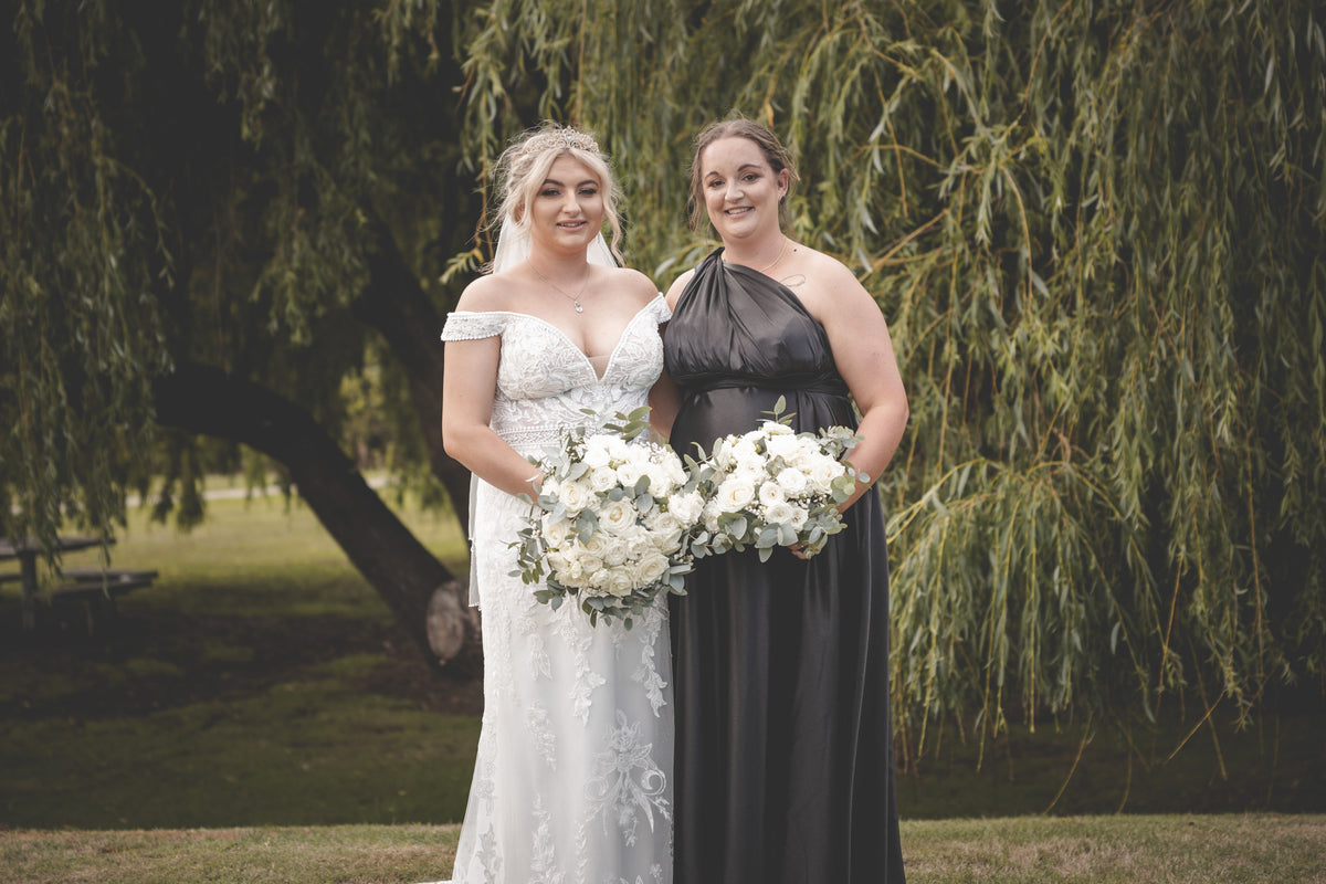 Bride and bridesmaids’ bouquets of white roses, carnations, Sweet William and Tasmanian eucalyptus at Tailrace Centre in Riverside, Launceston