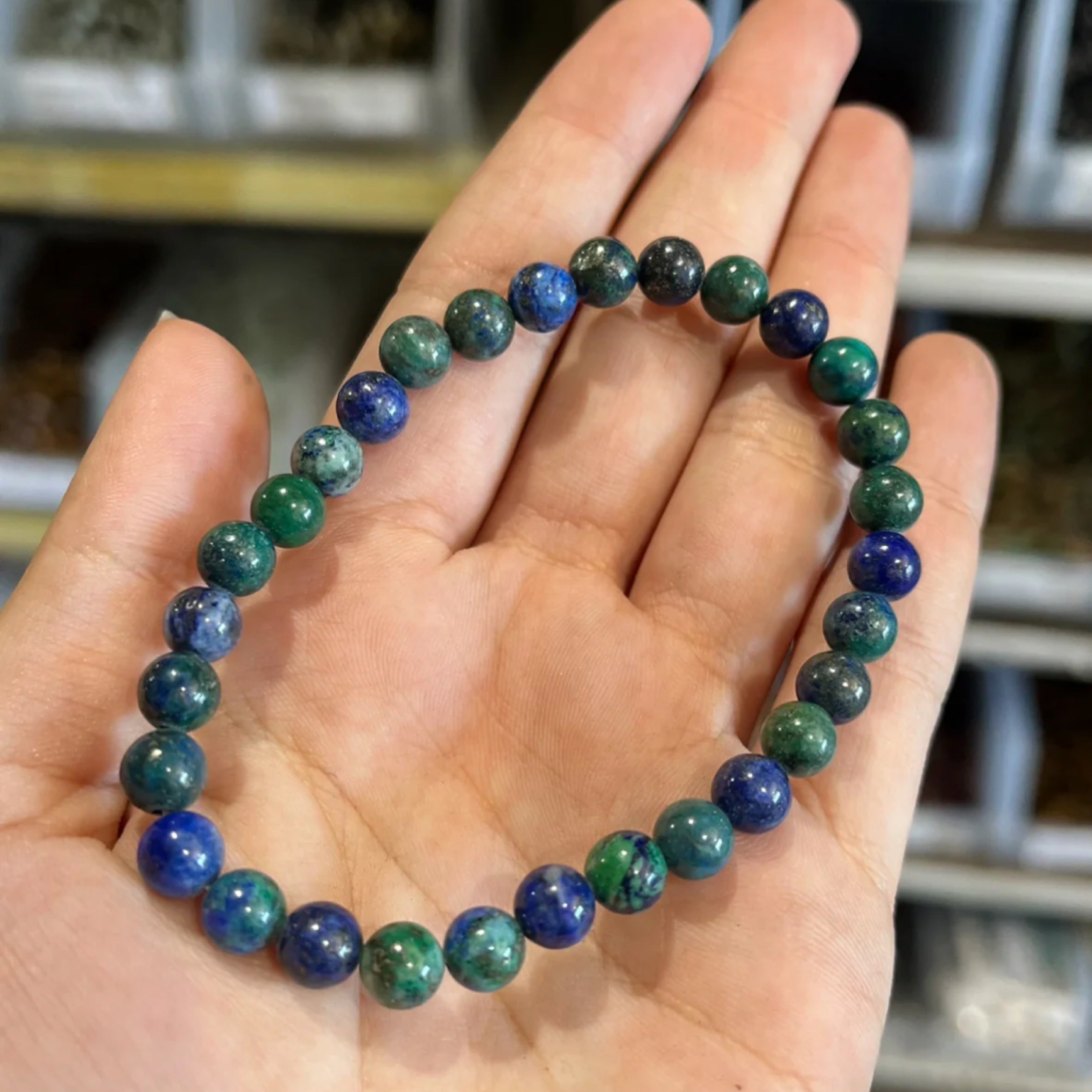 Chrysocolla and Lapis Bead Bracelet 6mm displayed on hand