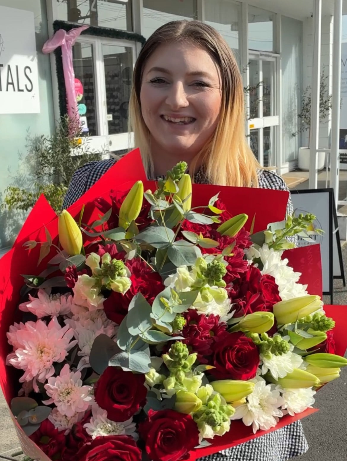 Florist Launceston Tasmania featuring a large, vibrant flower bouquet of red roses, white chrysanthemums, daisies, eucalyptus and white lily buds 