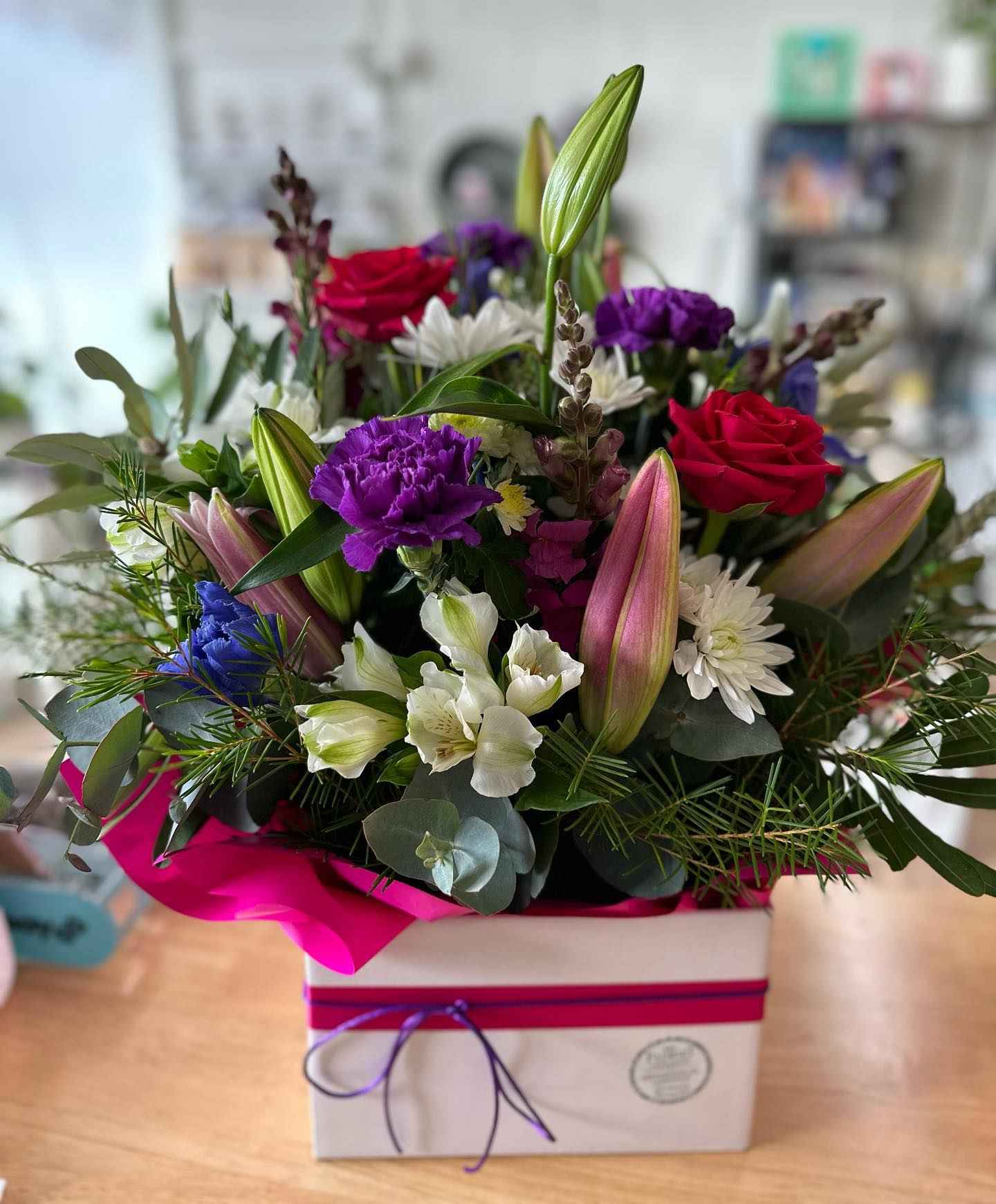 Roses, carnations and lilies in a floral arrangement from My Florist Launceston