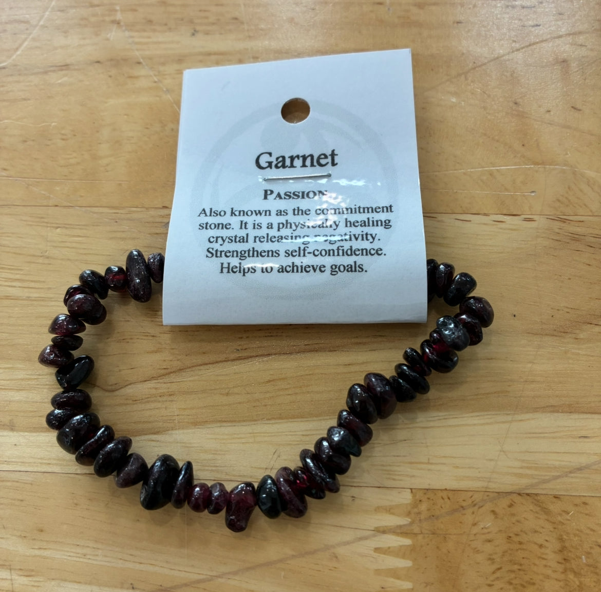 Garnet crystal chip bracelet with white label.