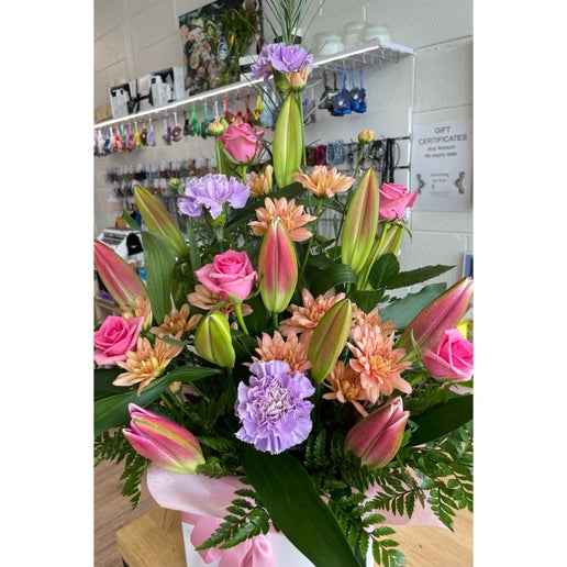 Ultra Seasonal Arrangement includes roses, carnations, lily and chrysanthemums