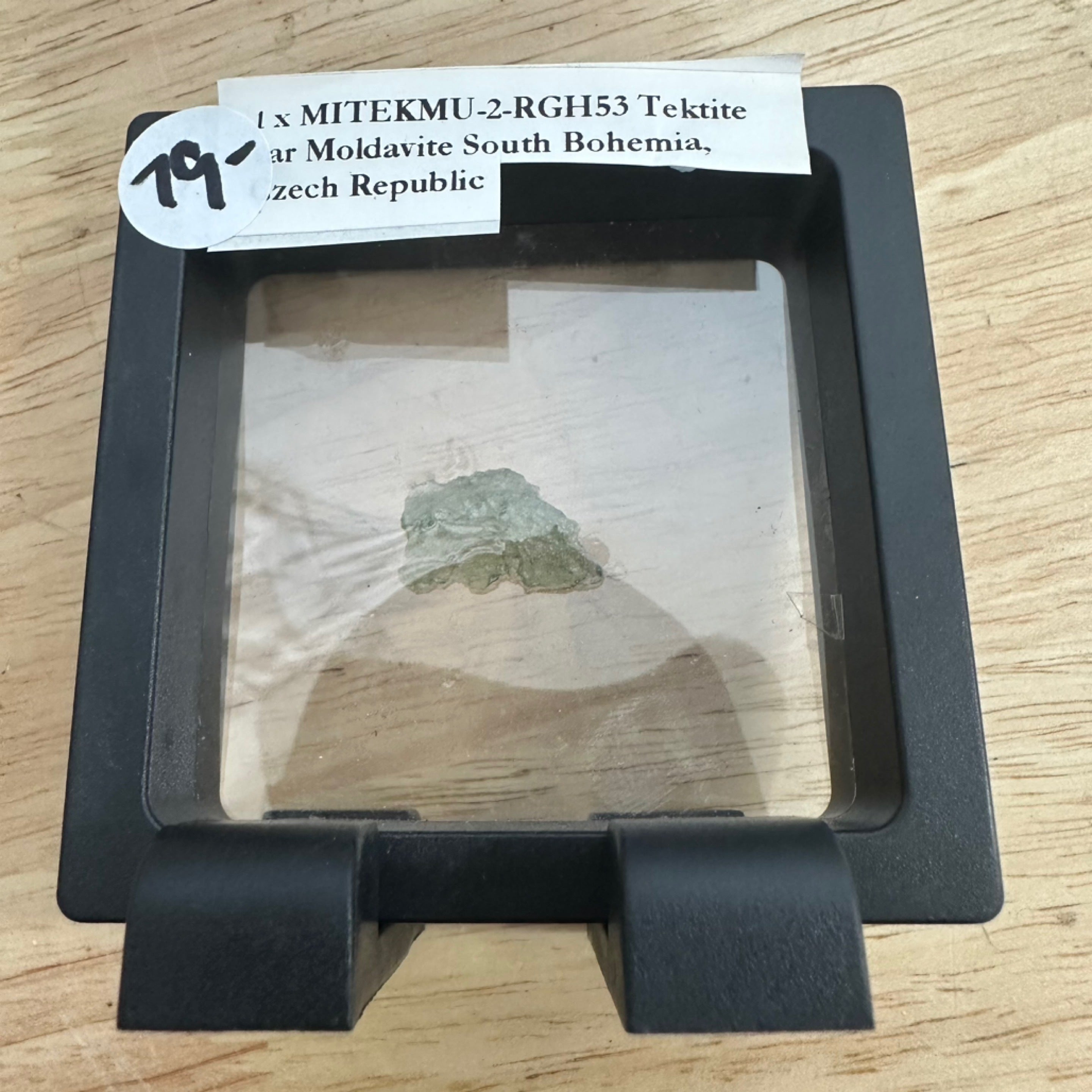 Moldavite specimen in black display box at My Florist Launceston
