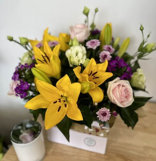 Colourful cheery flowers in yellow, pinks, purples and white for flowers Punchbowl delivery