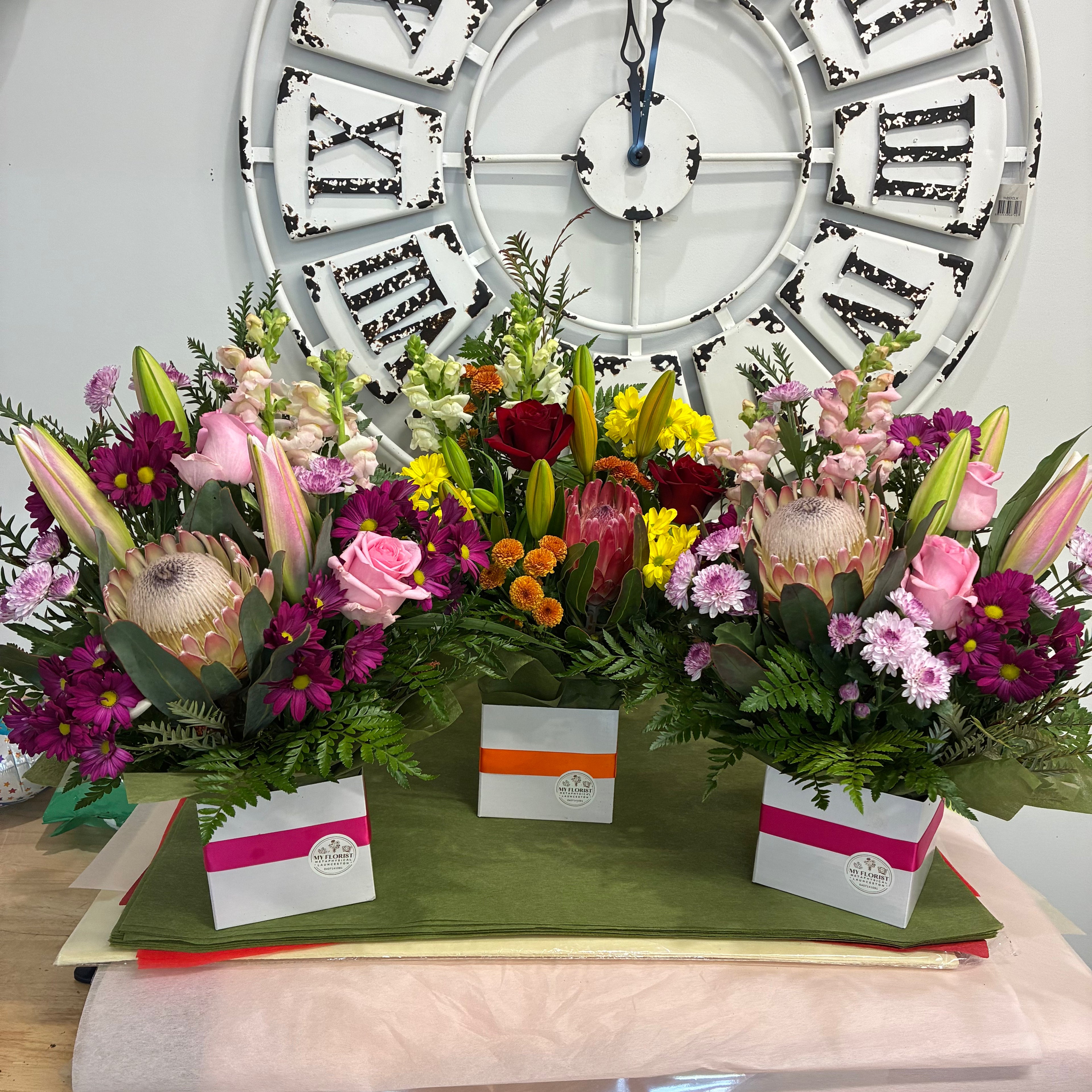 Mixed floral arrangements in brights and pastel shades