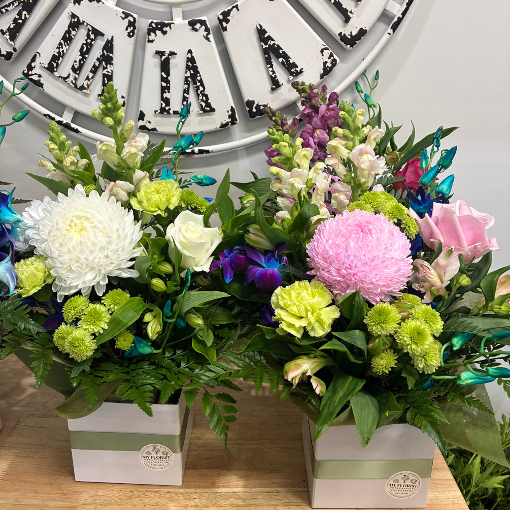 Colourful florist choice fresh flower box arrangement styled for hospital delivery.