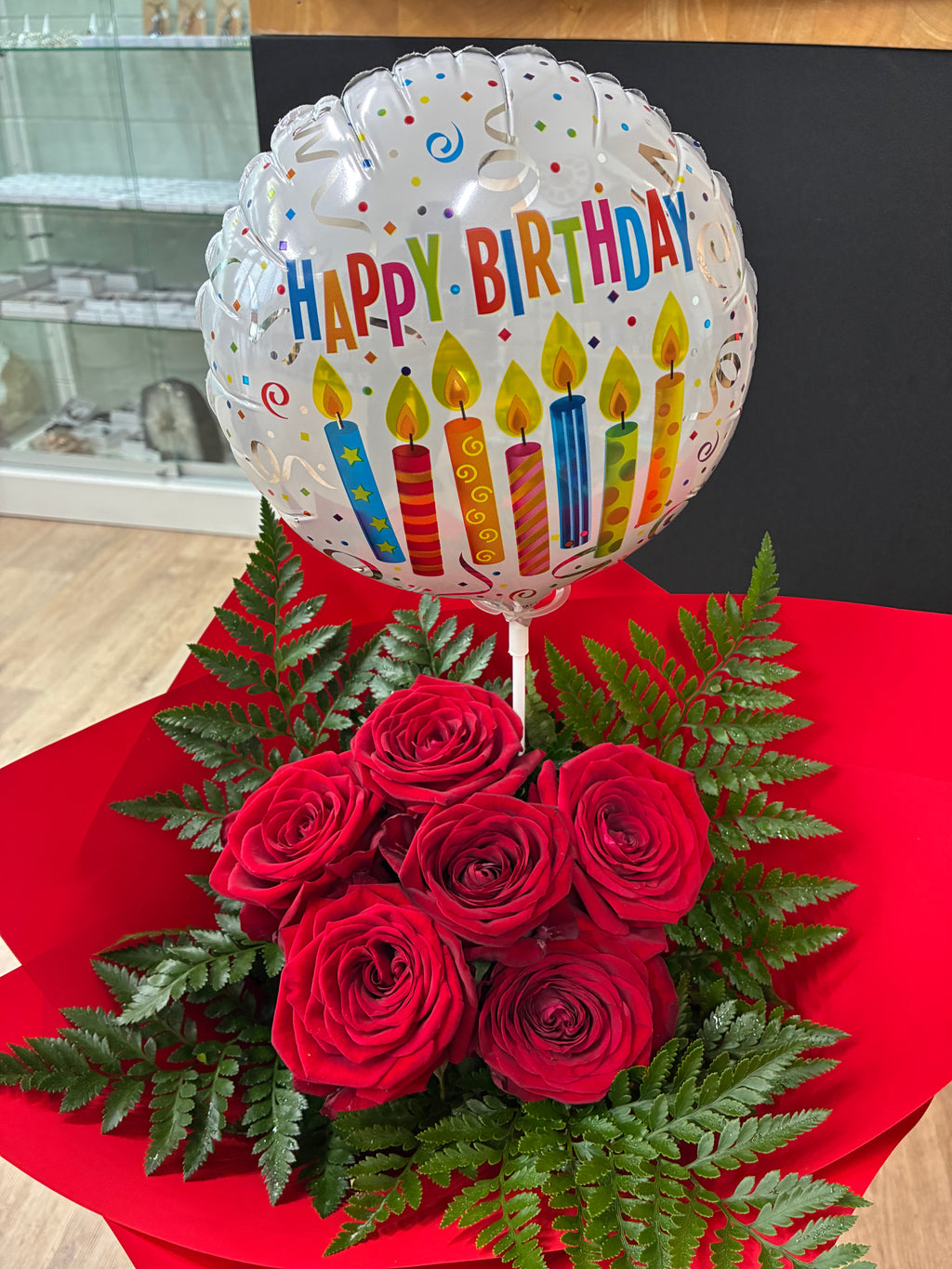 half dozen red roses giftwrapped with a balloon at My Florist Launceston