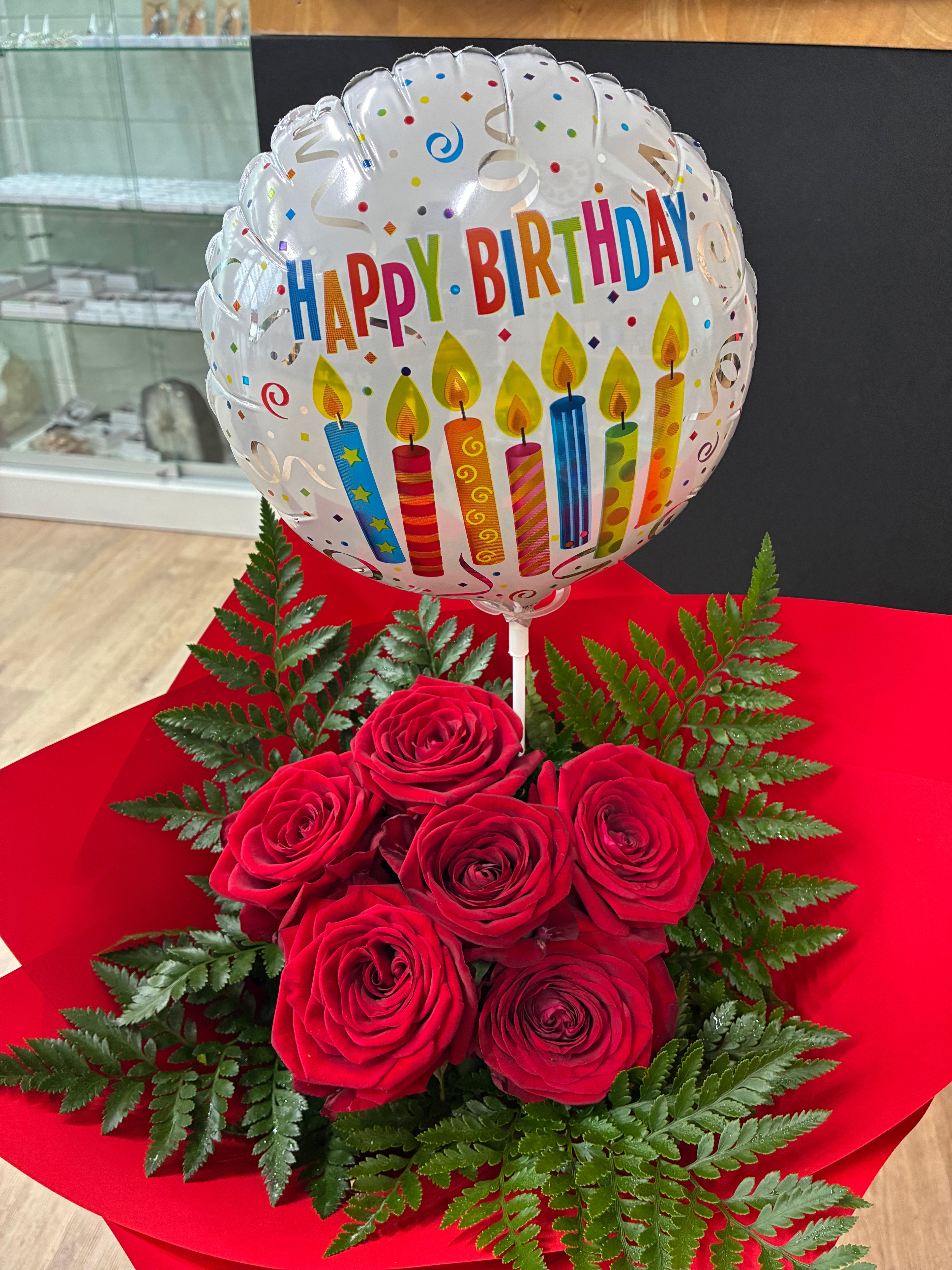 half dozen red roses giftwrapped with a balloon at My Florist Launceston
