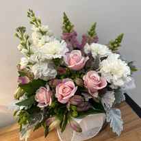 Seasons best flower arrangement in pink and white presented in a glass vase at My Florist