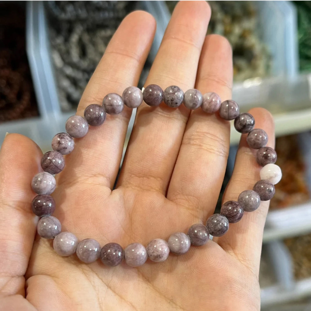 plum tourmaline bracelet shown on hand
