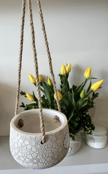 Seasonal Blooms in Hanging Ceramic Planter