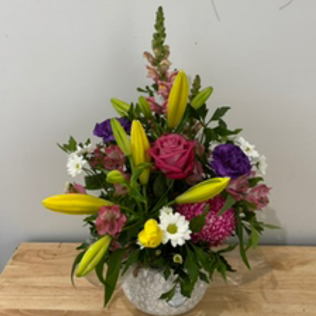 Seasonal Blooms in Hanging Ceramic Planter